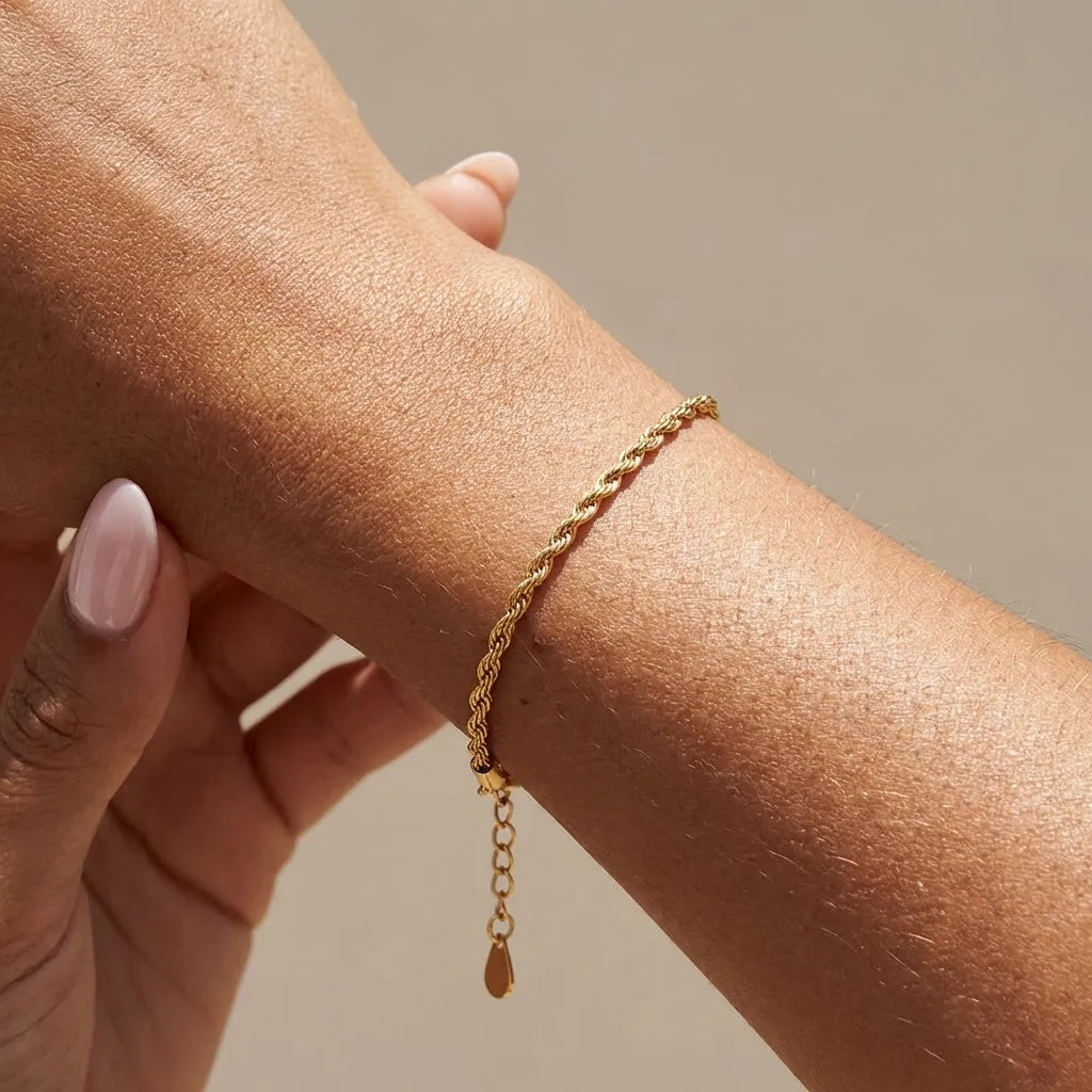 Calla gold rope chain bracelet with a short extender worn on the wrist