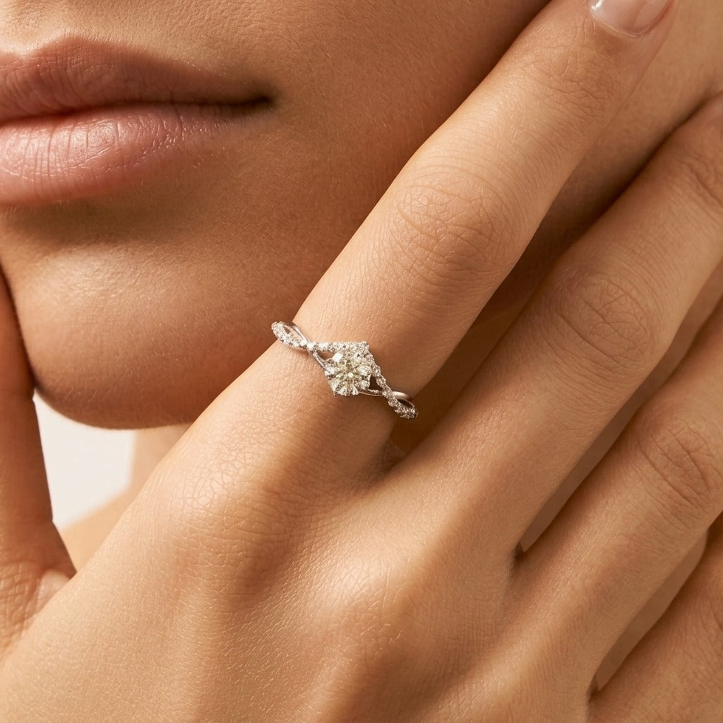 Woman wearing the Vivienne crystal silver ring with a round center stone on a twisted pavé band