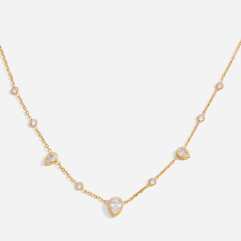 Lucie pear station gold necklace, the central pear-cut crystal and side stations on a fine gold chain