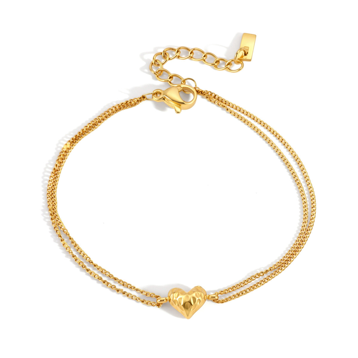 Adèle hammered heart gold bracelet with a puffed heart charm on two fine chains, white background