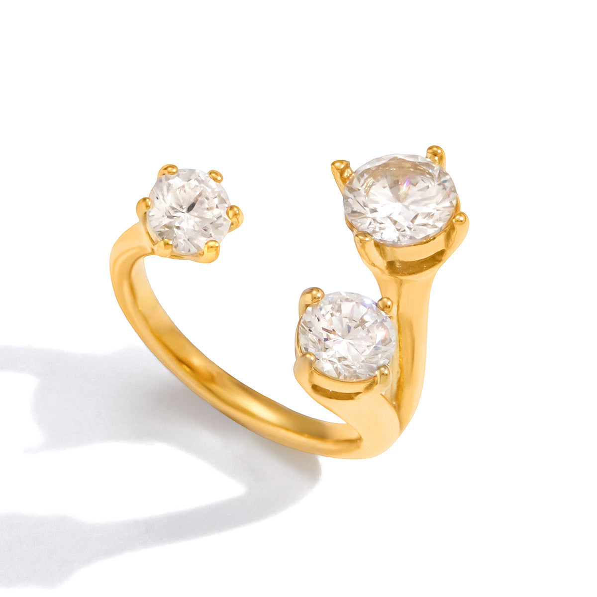 Side view of the Adriana ring: two crystals rising on a split gold stem opposite a smaller third