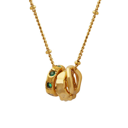 Benedetta triple ring gold necklace: hammered, smooth and green crystal rings on a beaded chain