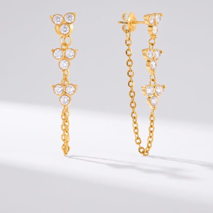 Bettina crystal cascade gold earrings on a plain white surface showing front and side views
