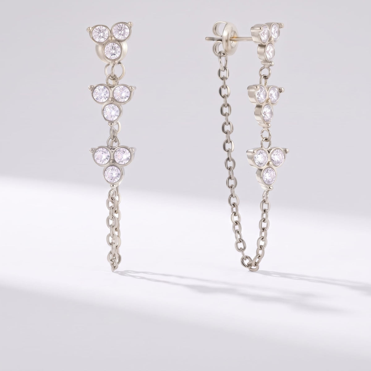 Bettina crystal cascade silver earrings on a plain white surface