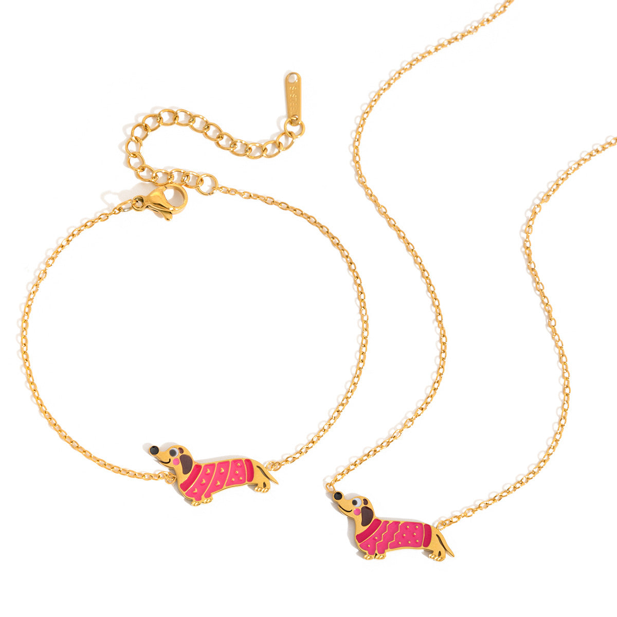 Bianca pink dachshund gold bracelet beside the matching necklace on a white background