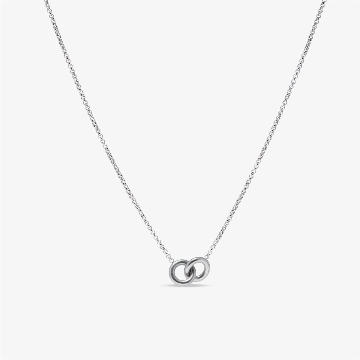 Colette interlocking rings necklace in silver on a fine chain against a white background