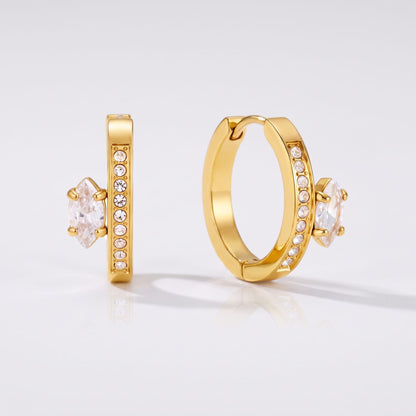Diletta marquise huggie gold earrings on a plain white background