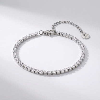 The Emma tennis chain silver bracelet on a light gray background