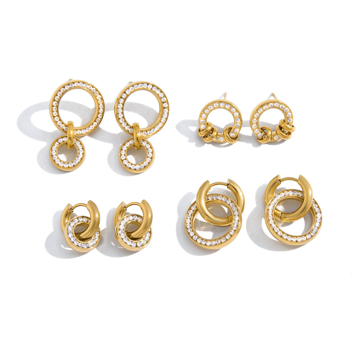 Gabrielle crystal circle studs with three looped gold rings, top right on a white background