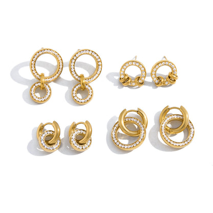 Gabrielle crystal circle studs with three looped gold rings, top right on a white background