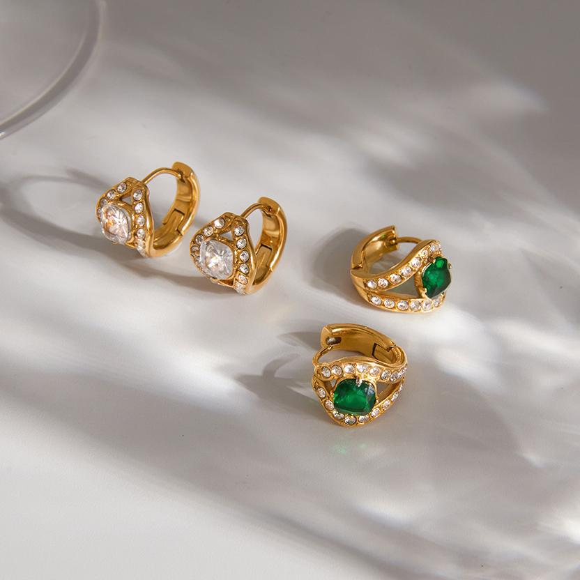 Clear and green Ilaria halo huggies on a sunlit white surface