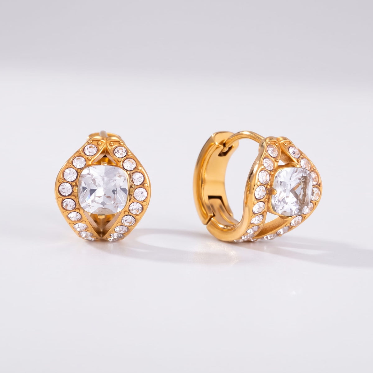 Ilaria cushion halo gold earrings on a plain light surface displaying front and side details