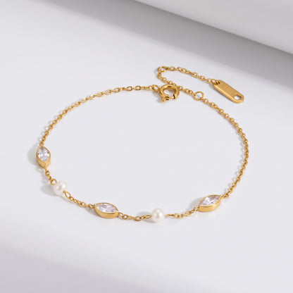 Liana marquise pearl gold bracelet on a white surface with a fine chain design