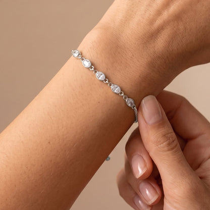 Woman wearing the Marisa oval crystal silver bracelet on the wrist