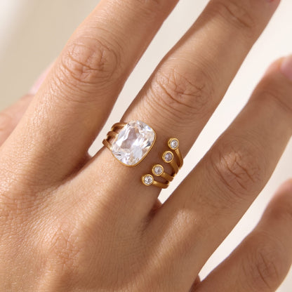 Close-up of the Olivia cushion crystal gold ring worn on a ring finger