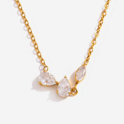 Close-up of the Rosalie cluster of two pear-cut crystals and a marquise on a gold chain