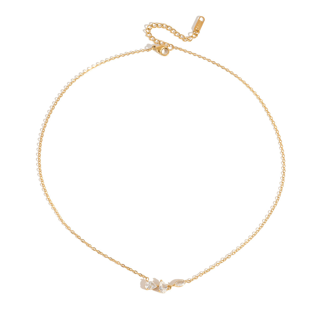 Rosalie pear cluster gold necklace laid flat with its extender chain on white