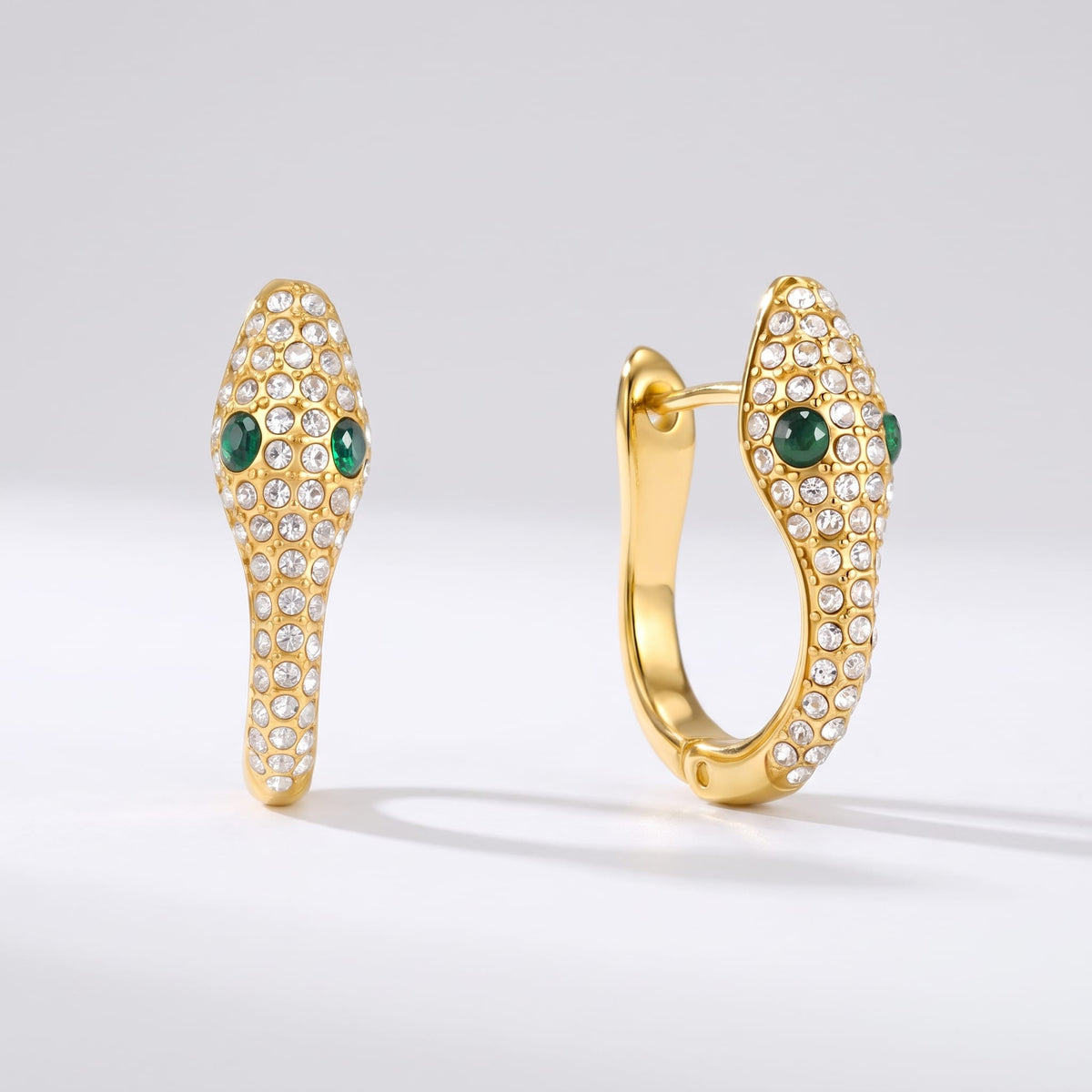 Sabine pavé snake gold earrings on a white plain background